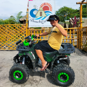 Explore La Union's Beauty on Four Wheels: A picturesque image of a group of friends enjoying a guided ATV tour, surrounded by the stunning natural landscape unique to Beach Camp, La Union.
